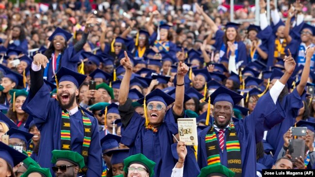 FILE - In this Saturday, May 7, 2016 file photo, students cheer as President Barack Obama delivers the commencement speech during the 2016 Howard University graduation ceremony in Washington, DC. Howard is a historically black university.