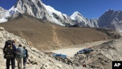 This April 10, 2016 photo shows trekkers heading to Everest Base Camp, Nepal. 