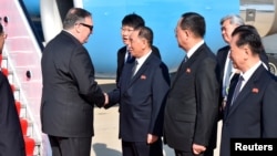 FILE - U.S. Secretary of State Mike Pompeo is greeted by senior North Korean official Kim Yong Chol, director of the United Front Department, which is responsible for North-South Korea affairs and Foreign Minister Ri Su Yong, on his arrival in Pyongyang during an earlier visit to North Korea.