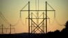 FILE - Power transmission lines stretch above the treetops in Maine, on Oct. 6, 2021. A former U.S. Marine was sentenced Oct. 28, 2024, for his role in a plot targeting U.S. power facilities.