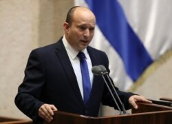 Israel's new prime minister, Naftali Bennett speaks during a Knesset session in Jerusalem, June 13, 2021