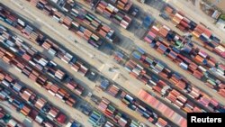 Containers are seen at a port in Ningbo, Zhejiang province, China, May 28, 2019.