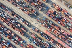 FILE - Containers are seen at a port in Ningbo, Zhejiang province, China, May 28, 2019.