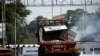 A damaged truck, that was used to transport humanitarian aid, is seen on the Francisco de Paula Santander cross-border bridge between Colombia and Venezuela, after clashes with opposition supporters and Venezuela's security forces, in Cucuta, Feb. 24, 2019.