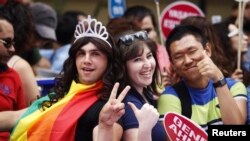 Participants gesture during a gay pride parade in central Istanbul, Turkey, June 29, 2014.