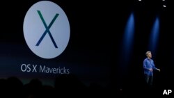 Craig Federighi, senior vice president of software engineering at Apple, introduces the new OS X Mavericks operating system during the keynote address of the Apple Worldwide Developers Conference,June 10 in San Francisco. (AP Photo/Eric Risberg)