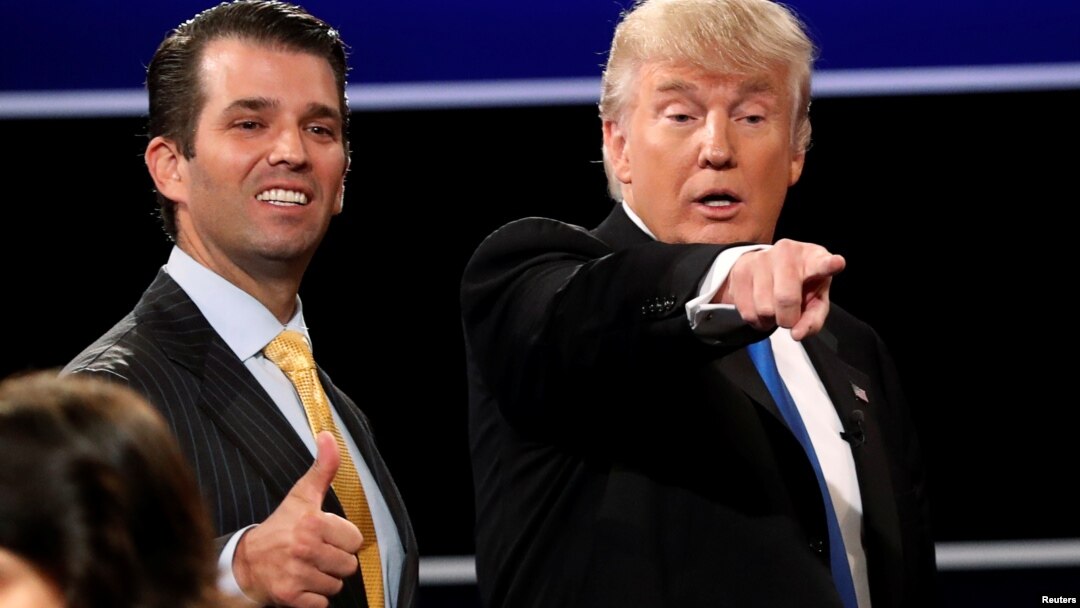 FILE - Donald Trump Jr. (L) gives a thumbs up beside his father Republican U.S. presidential nominee Donald Trump (R) after Trump's debate against Democratic nominee Hillary Clinton at Hofstra University in Hempstead, New York, Sept, 26, 2016.