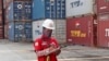 Seorang pekerja berada di dekat tumpukan kontainer di terminal Indonesia Port Corporation di Pelabuhan Tanjung Priok, Jakarta, 8 Oktober 2021. (Foto: AP/Tatan Syuflana)