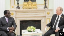 Zimbabwe President Robert Mugabe and Russian President Vladimir Putin in the Kremlin, in Russia