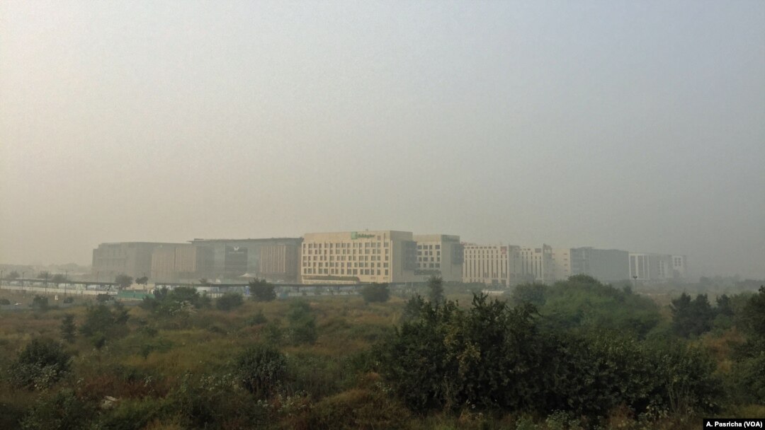 Buildings in New Delhi, India, are shrouded in a grey haze as air pollution levels reaches deadly levels this week, Nov. 6, 2016. 