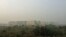 Buildings in New Delhi, India, are shrouded in a grey haze as air pollution levels reaches deadly levels this week, Nov. 6, 2016. 