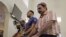 Muslims pray during prayer service at Baitul Naseer Mosque in Hallandale Beach, Florida, Dec. 18, 2015. Authorities in Titusville, Florida, have arrested a man accused of vandalizing a mosque with a machete and leaving pork products at the scene.