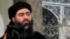 FILE - This image made from video posted on a militant website July 5, 2014, purports to show the leader of the Islamic State group, Abu Bakr al-Baghdadi, delivering a sermon at a mosque in Iraq.