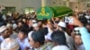 Muslim mourners in Yangon carry the coffin of Ko Ni, a slain NLD member and lawyer, Jan. 30, 2017. (Paul Vrieze/VOA)