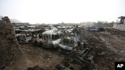 FILE - Destroyed cars are seen after an April 19 Taliban-claimed suicide attack in Kabul, Afghanistan, April 20, 2016. The attack, which killed nearly 70 people, pushed President Ashraf Ghani to take more resolute action against the miltant group.