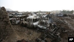 Destroyed cars are seen on the ground after yesterday's Taliban-claimed deadly suicide attack in Kabul, Afghanistan, April 20, 2016.