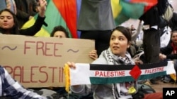 Demonstrators sit as around 100 pro-Palestinian activists stage a protest at Brussels national airport in Zaventem, Israel, early April 15, 2012. 