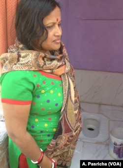 Poonam Sode's tiny, newly constructed latrine connected to a sewer line in a crowded slum in East Delhi has ended long waits at a community toilet and visits to a nearby open area.