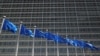 FILE - European Union flags flutter outside the EU Commission headquarters in Brussels, Belgium June 20, 2018.