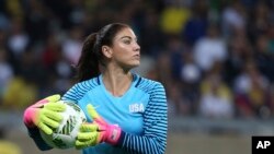 FILE - United States' goalkeeper Hope Solo takes the ball during a women's soccer game at the Rio Olympics against New Zealand in Belo Horizonte, Brazil, Aug. 3, 2016. 