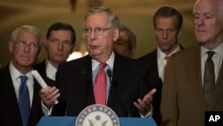 FILE - Senate Respublican Majority Leader Mitch McConnell, flanked by Republican colleagues, speaks to the media on Capitol Hill in Washington, Dec. 6, 2016.