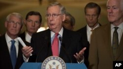FILE - Senate Republican Majority Leader Mitch McConnell, flanked by Republican colleagues, speaks to the media on Capitol Hill in Washington, Dec. 6, 2016. Republican leaders on Capitol Hill have long pledged to repeal and replace Obamacare.