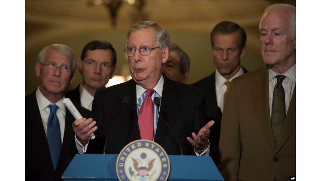 FILE - Senate Respublican Majority Leader Mitch McConnell, flanked by Republican colleagues, speaks to the media on Capitol Hill in Washington, Dec. 6, 2016.