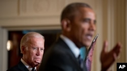 Vice President Joe Biden listens as President Barack Obama, right, delivers remarks to members of the 2016 United States Summer Olympic and Paralympic Teams during a ceremony in the East Room of the White House in Washington, Thursday, Sept. 29, 2016. (AP Photo/Andrew Harnik)