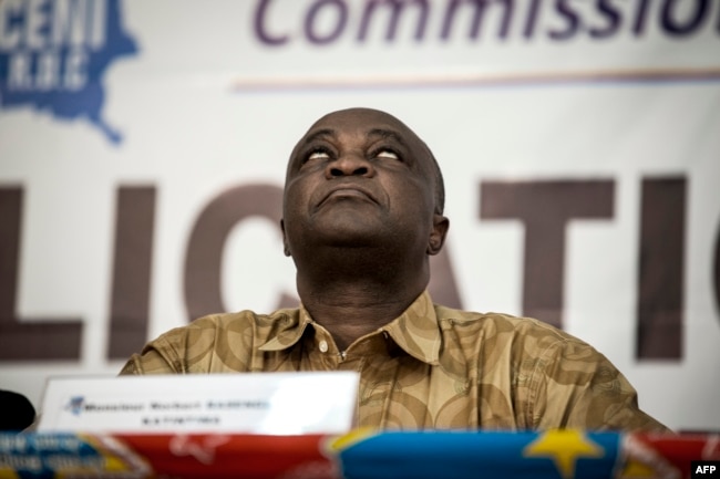 FILE - Vice President of the Commission Electorale Nationale Independante (CENI), Norbert Basengezi reacts during the announcement of the new electoral calendar for December 2018 presidential elections, Nov. 5, 2017 in Kinshasa.