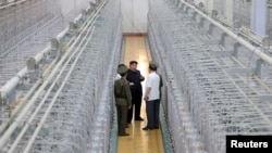 North Korean leader Kim Jong Un tours the Nuclear Weapons Institute and the production base of weapon-grade nuclear materials at an undisclosed location in North Korea, in this photo released by North Korea's official Korean Central News Agency, Sept. 13, 2024. 