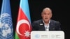 FILE - Cook Islands Prime Minister Mark Brown speaks during a plenary session at the COP29 UN Climate Summit, Nov. 13, 2024, in Baku, Azerbaijan. 