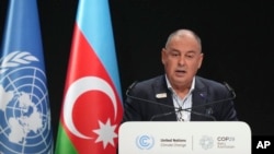 FILE - Cook Islands Prime Minister Mark Brown speaks during a plenary session at the COP29 UN Climate Summit, Nov. 13, 2024, in Baku, Azerbaijan. 