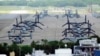 FILE - U.S. MV-22 Osprey aircraft are parked at the U.S. Marine Corps Air Station Futenma in Ginowan, south of Okinawa, southern Japan, Sept. 6, 2023.