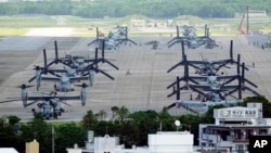 FILE - U.S. MV-22 Osprey aircraft are parked at the U.S. Marine Corps Air Station Futenma in Ginowan, south of Okinawa, southern Japan, Sept. 6, 2023.