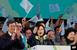 Taiwan's Democratic Progressive Party presidential candidate Tsai Ing-wen speaks to supporters during a large campaign rally in Kaohsiung, Taiwan, Saturday, Jan. 9, 2016. Taiwan will hold its presidential election on Jan. 16, 2016.