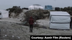 A still taken from BAFTA nominated short film ‘Aamir’, showing Aamir (played by Alan Asaad) in Calais, France.
