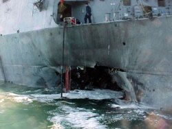 FILE - Port side damage to the guided missile destroyer USS Cole is pictured after a bomb attack during a refueling operation in the port of Aden, Oct. 12, 2000.