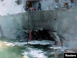 FILE - Port side damage to the guided missile destroyer USS Cole is pictured after a bomb attack during a refueling operation in the port of Aden, Oct. 12, 2000.