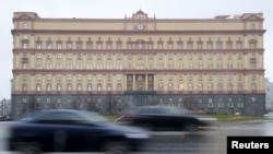 FILE - Cars drive past the headquarters of the Federal Security Service (FSB) in central Moscow, Russia, Nov. 10, 2015.