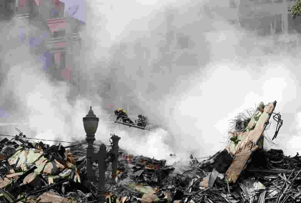 Firefighters work in the the rubble of a building that caught fire and collapsed in Sao Paulo, Brazil.