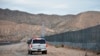 FILE - A U.S. Border Patrol agent patrols Sunland Park along the U.S.-Mexico border next to Ciudad Juarez, Jan. 4, 2016. A 7-year-old girl who had crossed the U.S.-Mexico border with her father, died after being taken into the custody of the U.S. Border Patrol.