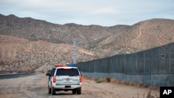 FILE - A U.S. Border Patrol agent patrols Sunland Park along the U.S.-Mexico border next to Ciudad Juarez, Jan. 4, 2016. A 7-year-old girl who had crossed the U.S.-Mexico border with her father, died after being taken into the custody of the U.S. Border Patrol.