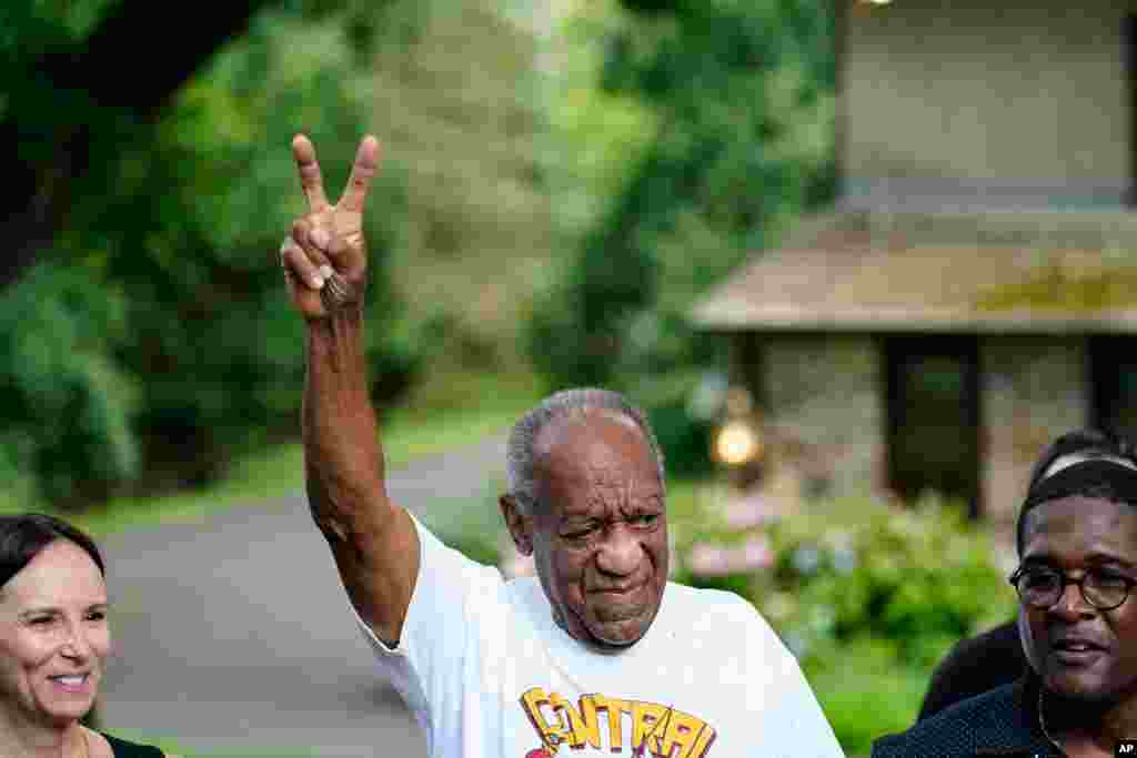 Bill Cosby gestures outside his home in Elkins Park, Pa., June 30, 2021, after being released from prison. Pennsylvania's highest court has overturned comedian Cosby's sex assault conviction.