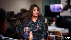 FILE - Seema Misra speaks at her home in Knaphill, England, Jan. 12, 2024. Misra and three other victims of the Horizon IT scandal, in which hundreds of subpostmasters were wrongly convicted of fraud, theft and false accounting, were honored by King Charles III.