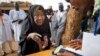 FILE - An elderly Nigerian woman is seen participating in elections in Daura, Nigeria, March 28, 2015.