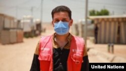 Sameeh, a Syrian refugee, serves as a community health volunteer for Save the Children, a UNHCR health partner in Za'atari Camp, Jordan. He has helped other refugees register for the COVID-19 vaccine. (© UNHCR/Yousef Alhariri)