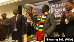 iimbabwe President Emmerson Mnangwagwa. Also in the picture, Zimbabwe Ambassador to the U.S. Ammon Mutembwa (far left); Finance Minister Mthuli Ncube (left) and Zimbabwe Ambassador to the UN Frederick Shava.