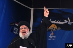 FILE - Lebanon's Hezbollah main  Sayyed Hassan Nasrallah addresses a assemblage  successful  a confederate  Beirut suburb connected  Oct. 12, 2016.