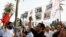 Anti-government protesters from '20th February', the Moroccan Arab Spring movement, shout in front of parliament. Sep. 22, 2013