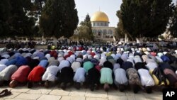 Palestinians pray inside the al-Aqsa Mosque compound in Jerusalem's Old City, July 27, 2017. Anticipated unrest there Friday did not materialize.